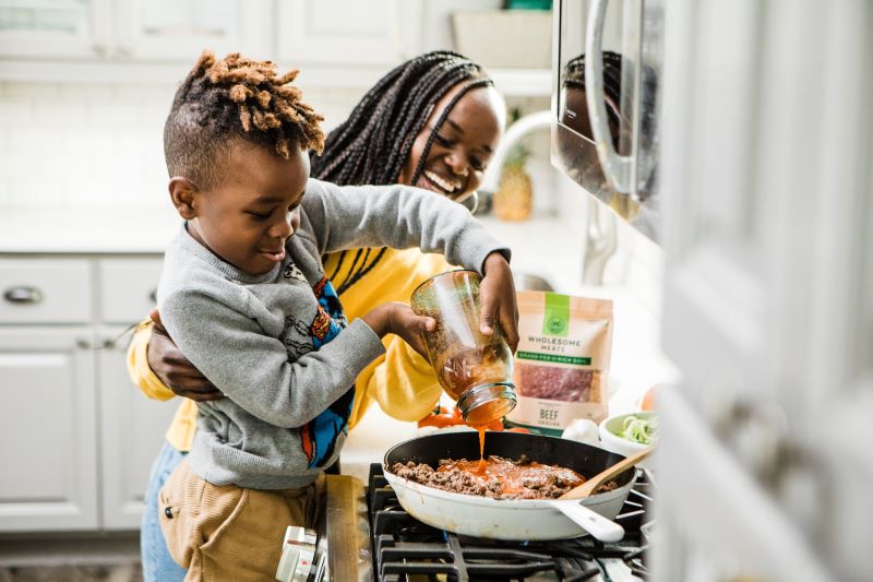 mother and son cooking together