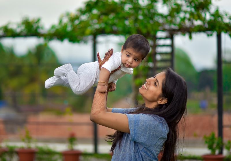 mother-lifting-baby.jpg