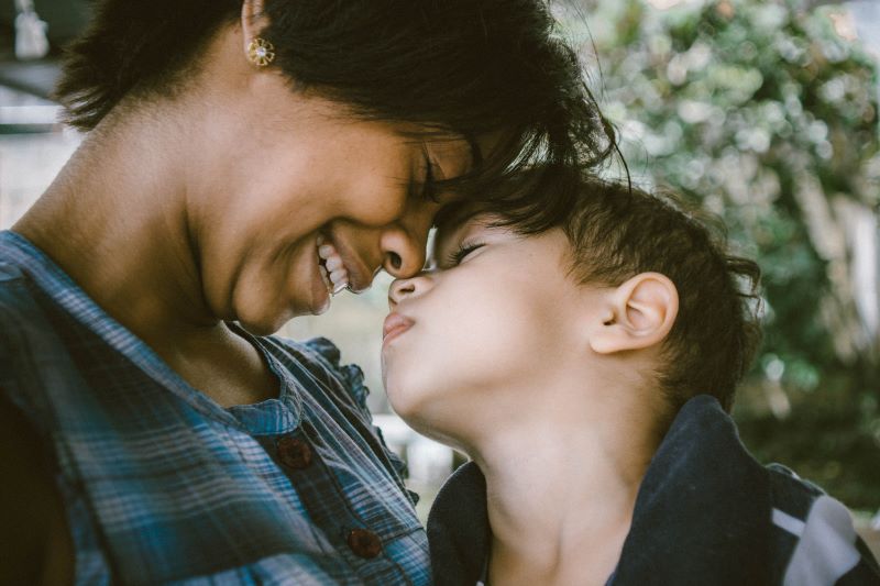 mother nuzzling son